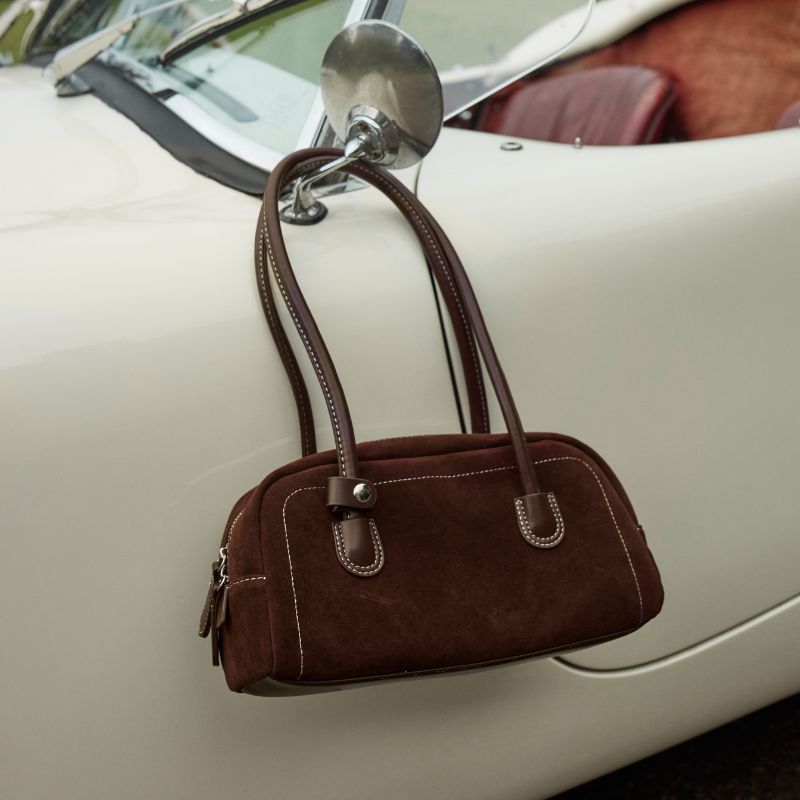 complete your look with our latest bags, shop now >